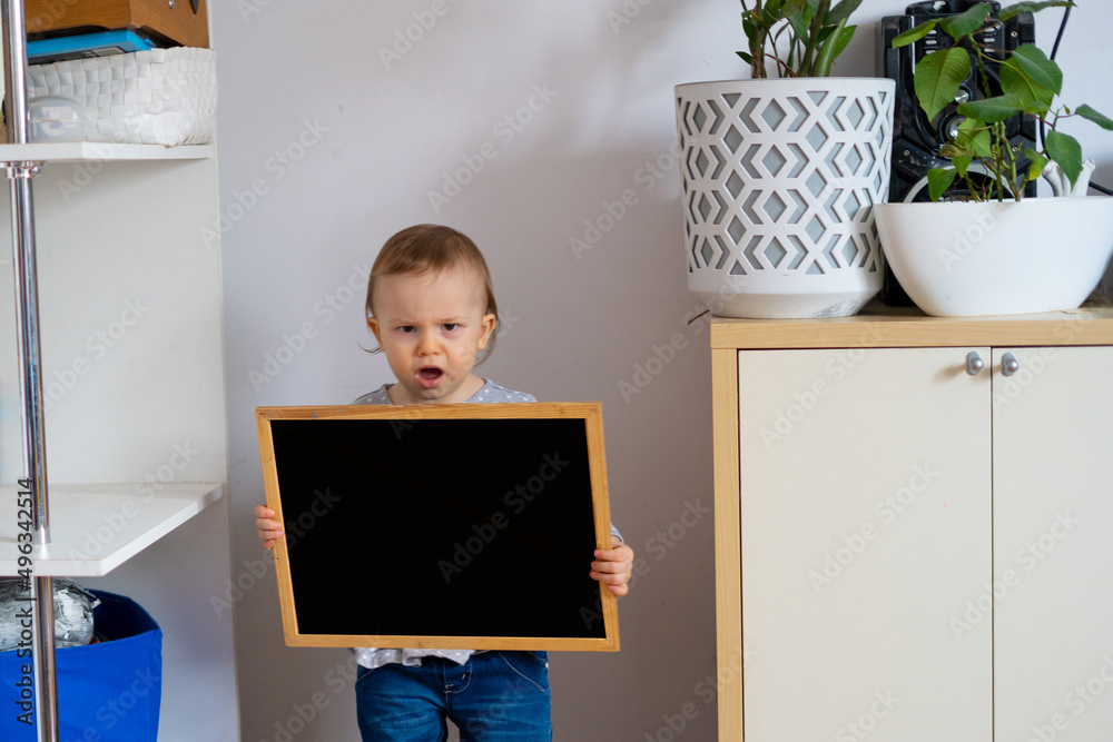 adorable little girl holds chalkboard that says school adorable little girl holds chalkboard that says school