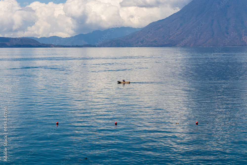 traditional fisherman silhouette on lake atitlan guatemala