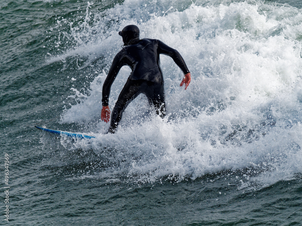 a surfer surf a wave in italy
