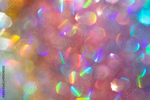 Abstract defocused multicolored background with shining glitter.Good as overlay layer.