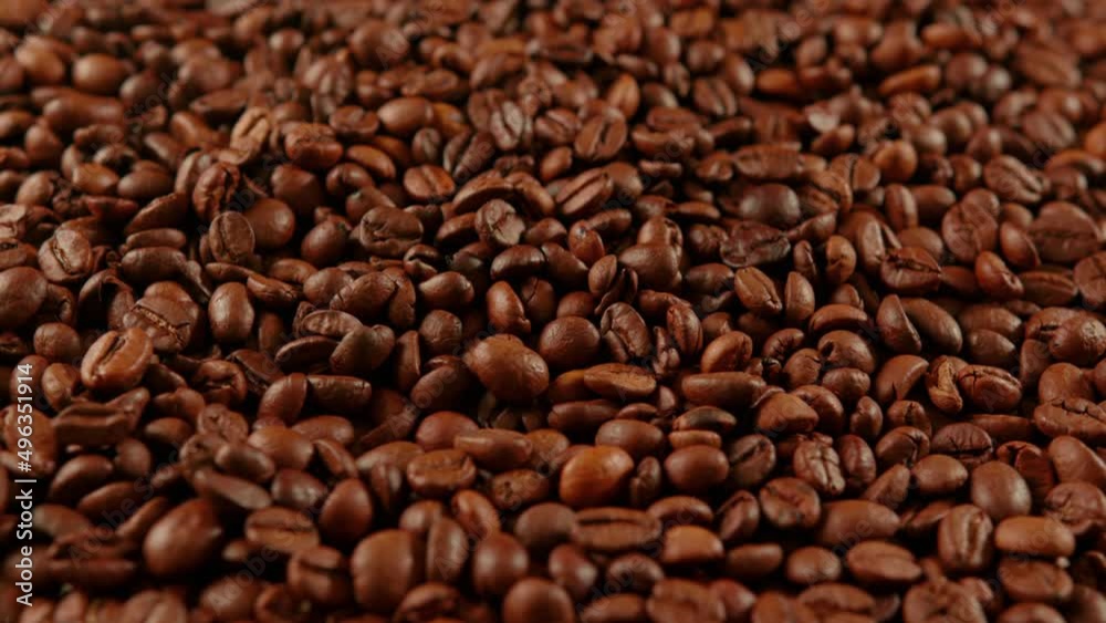 Texture of freshly coffee beans. Lots of roasted beans for preparation of fragrant drink. Close up. Texture of freshly coffee beans. Lots of roasted beans for preparation of fragrant drink. Close up.