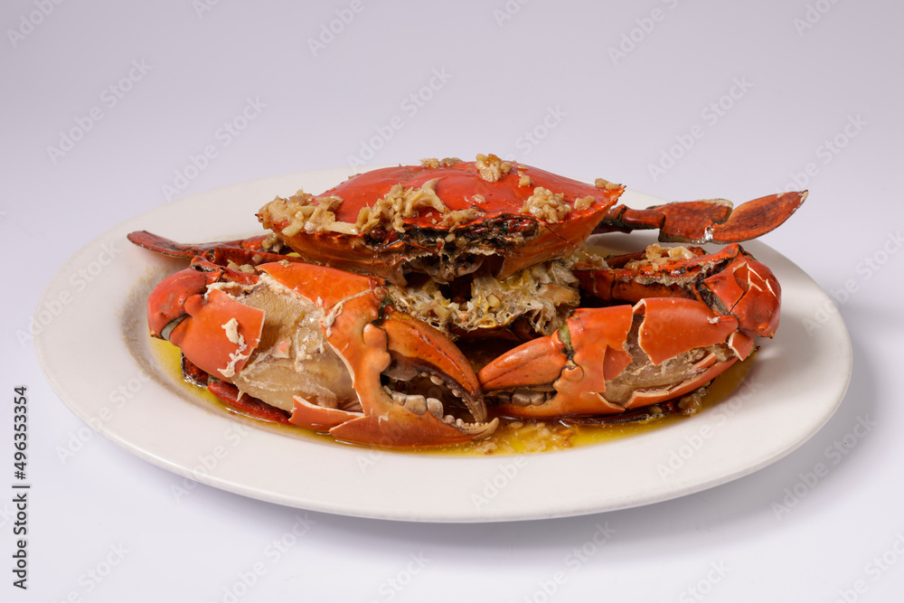 BUTTER GINGER CRAB WOKKIN in a dish top view on grey background singapore food