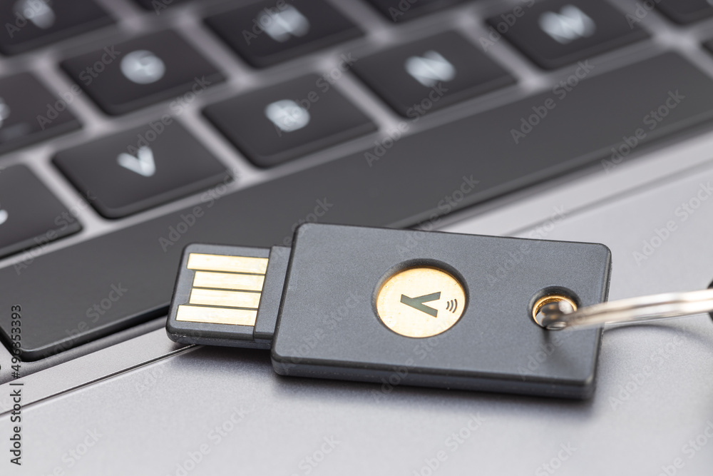 Galicia, Spain; April 1, 2022: Yubikey hardware key on laptop. Yubikey ...
