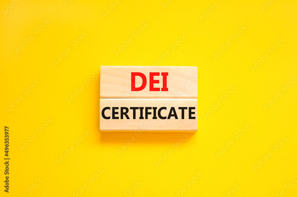DEI diversity equity inclusion certificate symbol. Blocks with words DEI certificate on beautiful yellow background. Business DEI diversity equity inclusion certificate concept. Copy space.