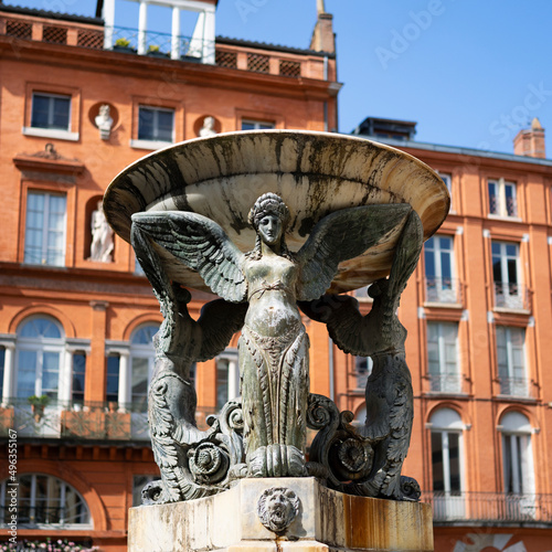 The beautiful Statue, Trinity fountain in the historical district of Toulouse