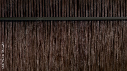 Photography Black plastic comb combing brown hair | Hair moisturizing concept
