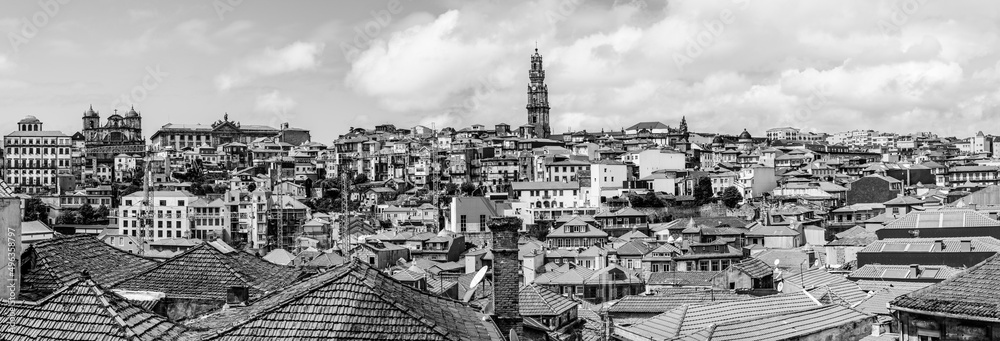 Porto, Portugal: Old town skyline with Clerigos tower, the cathedral and old houses roof tops in black and white