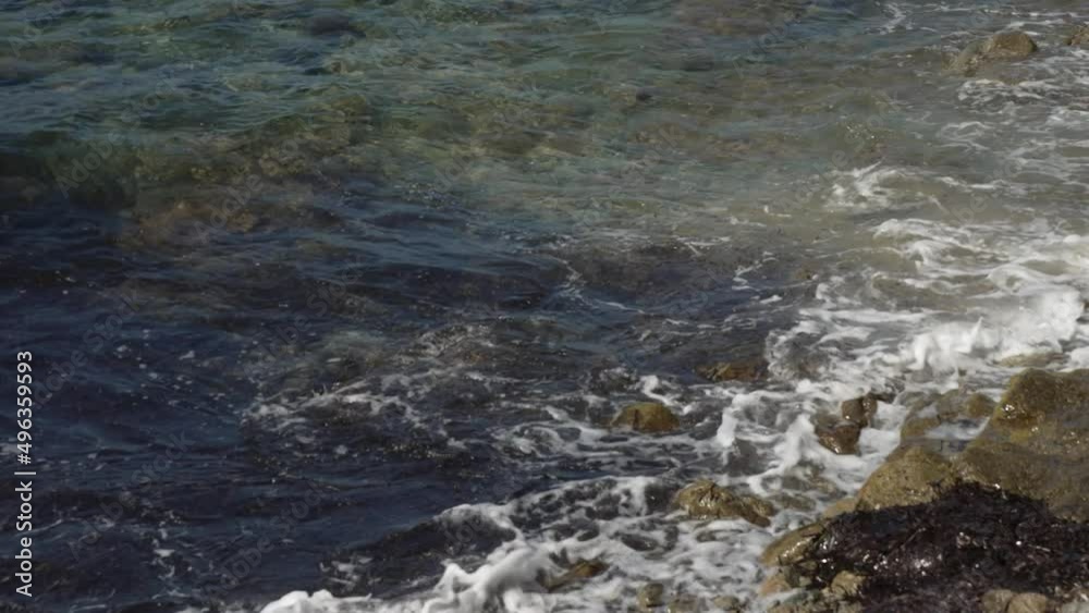 Waves lapping on shore and small chapel on Aegean Sea, Mykonos Town, Mykonos, Cyclades, Greek Islands Waves lapping on shore and small chapel on Aegean Sea, Mykonos Town, Mykonos, Cyclades, Greek Islands