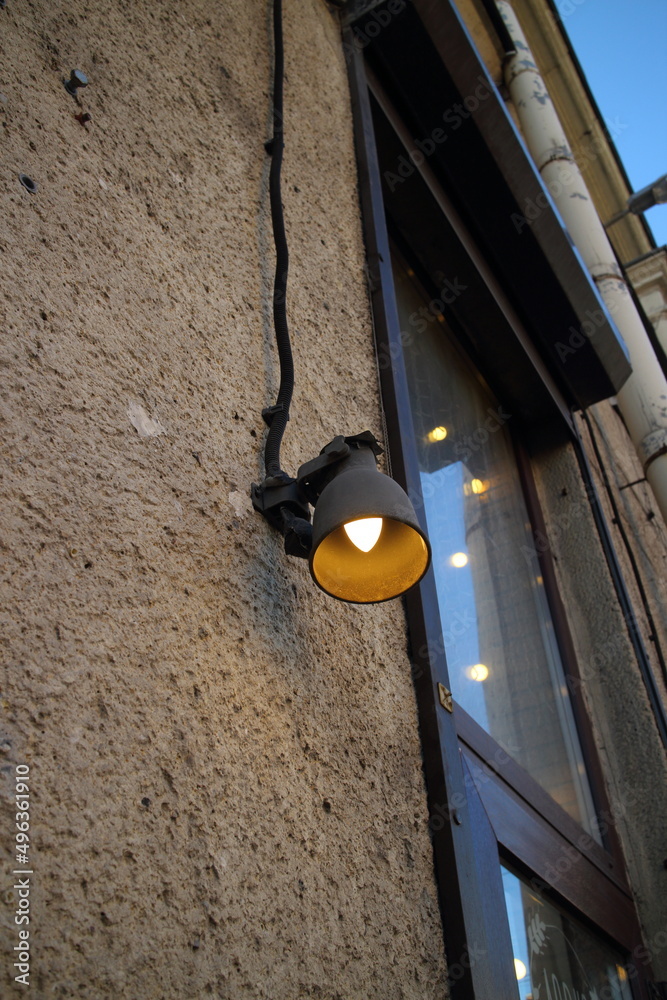 street lamp on the wall of the building