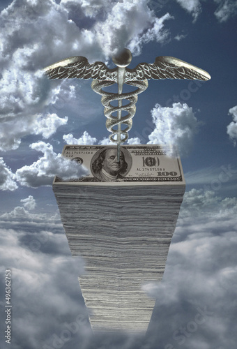 Stack of American dollar bills and a caduceus photo