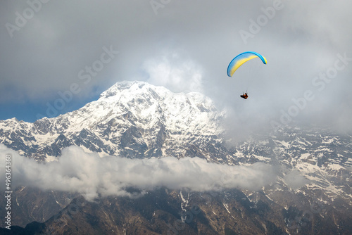 A man paragliding, Annapurna region, Himalayas near Pokhara, Nepal  photo