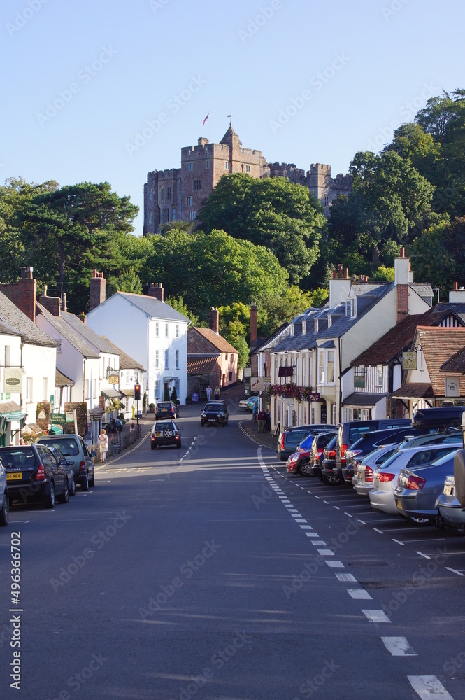 Dunster, UK: view of Dunster High Street and the castle in the background