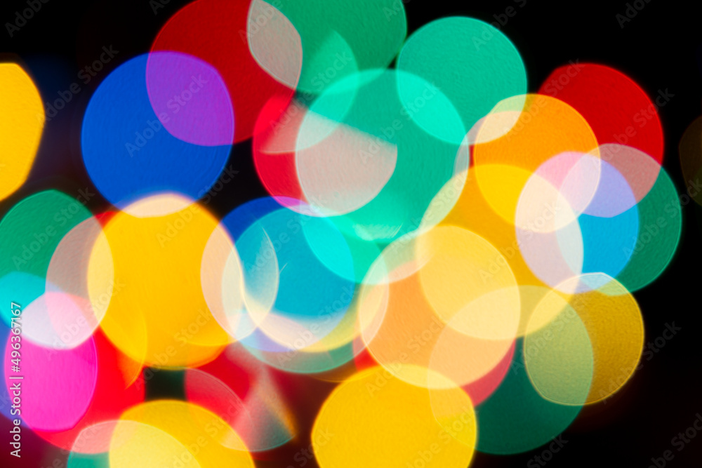 Colorful and blurred led light bokeh on isolated black background.