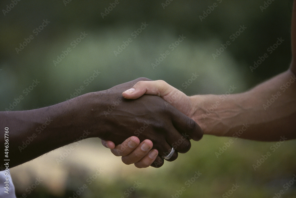 Close-up of two people shaking hands Close-up of two people shaking hands