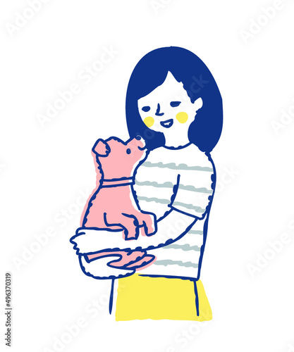 子犬を抱っこしている笑顔の女性