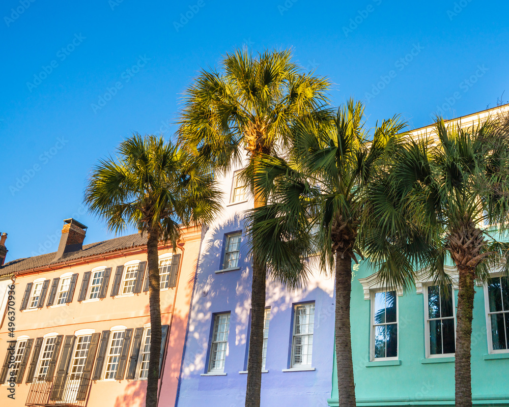 Historic Rainbow Row colorful house and palm trees seen in Charleston South Carolina