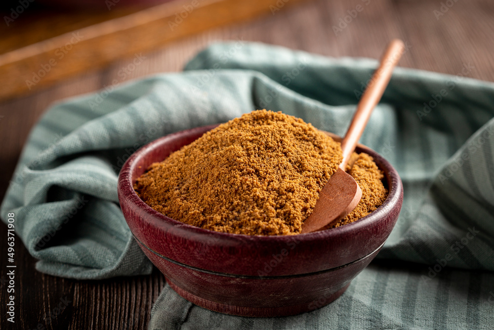 Brown sugar in wooden bowl on the table. Brown sugar in wooden bowl on the table.