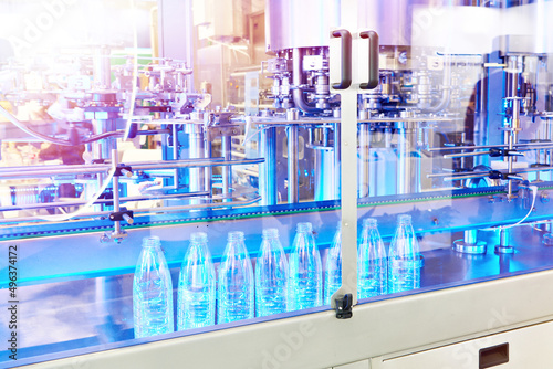 Plastic water bottles on packaging conveyor