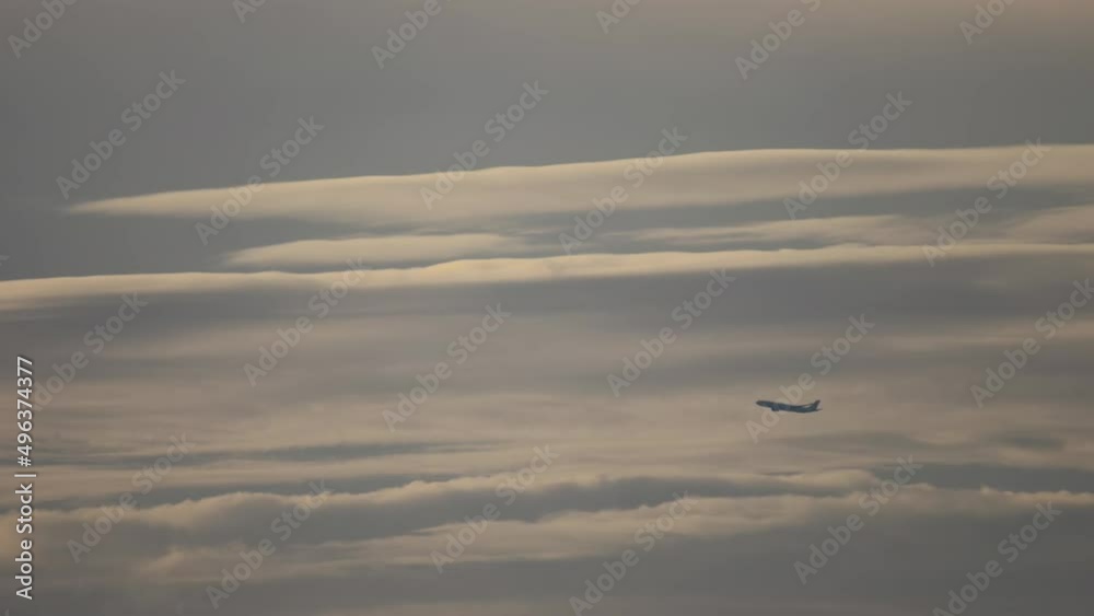 Long shot aircraft flying gaining altitude in the sky. Side view, airliner climb after takeoff. Tourism and travel concept Long shot aircraft flying gaining altitude in the sky. Side view, airliner climb after takeoff. Tourism and travel concept