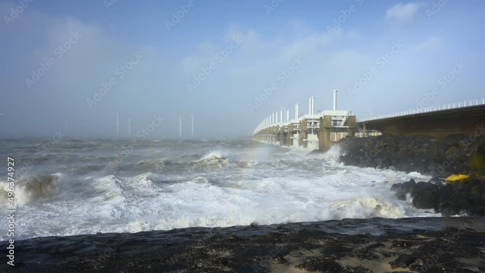 Waves crashing during storm Eunice, Vrouwenpolder, Netherlands