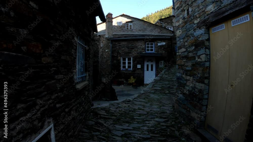 DOLLY SHOT - The picturesque little schist village of Piodão clings to a steeply terraced mountainside deep within the foothills of the Serra de Açor range in central Portugal. Schist stairs. DOLLY SHOT - The picturesque little schist village of Piodão clings to a steeply terraced mountainside deep within the foothills of the Serra de Açor range in central Portugal. Schist stairs.
