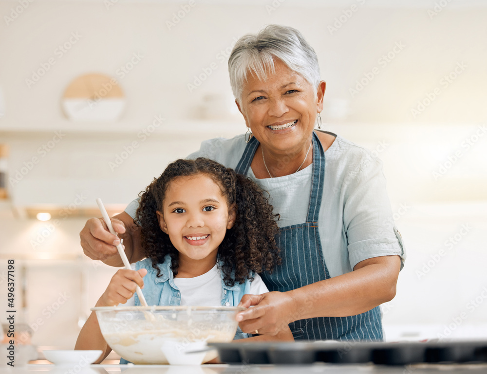 Gran is giving me some baking lessons. Shot of a little girl baking with her grandmother at home. Gran is giving me some baking lessons. Shot of a little girl baking with her grandmother at home.