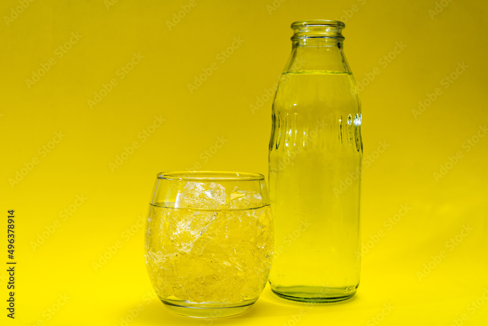 Glass beaker and bottle filled with ice and purified water. Glass beaker and bottle filled with ice and purified water.