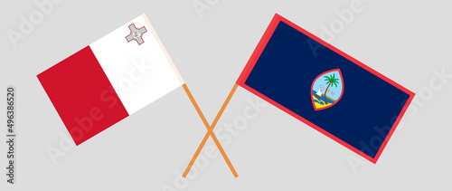 Crossed flags of Malta and Guam. Official colors. Correct proportion photo