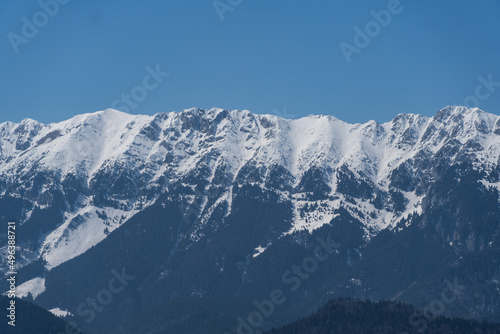 snow covered mountains  Piatra Craiului Mountains  viewpoint from Magura Branului Mountains  Romania 