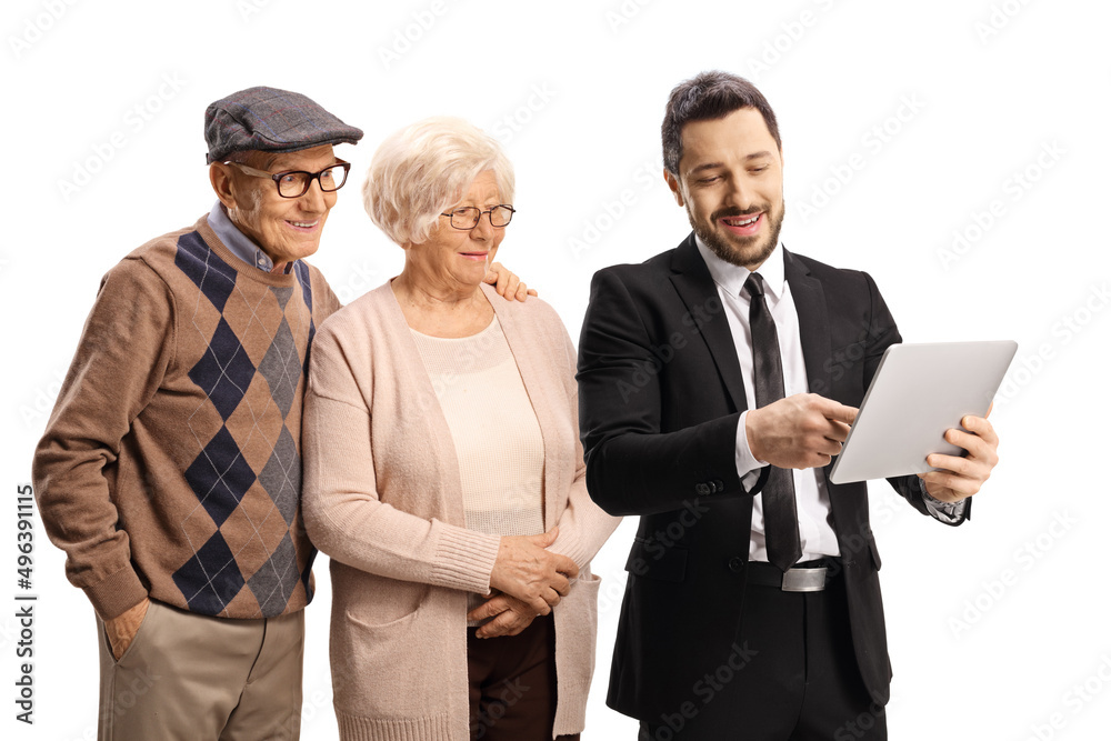 Salesman showing a digital tablet to an elderly man and woman Salesman showing a digital tablet to an elderly man and woman
