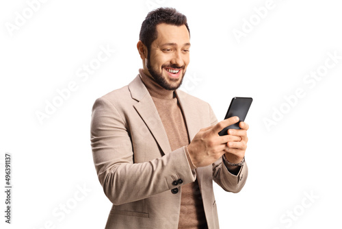Happy young man using a smartphone and smiling © Ljupco Smokovski