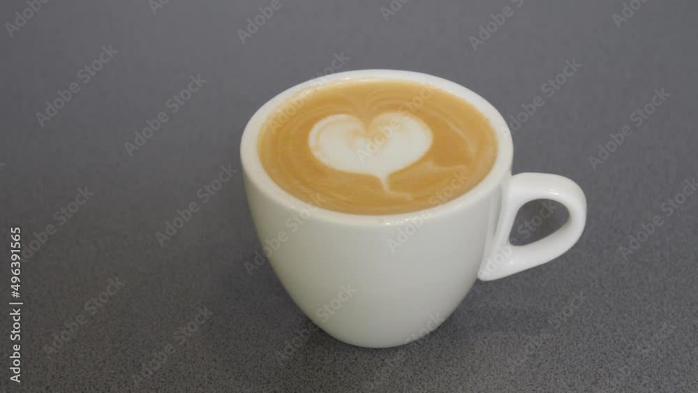 light brown fresh mocha with nice latte art in a cafe. light brown fresh mocha with nice latte art in a cafe.