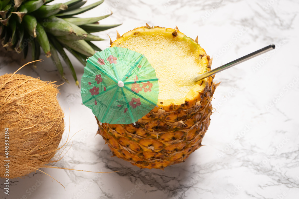 Pina colada cocktail with umbrella and coconut - obrazy, fototapety, plakaty 