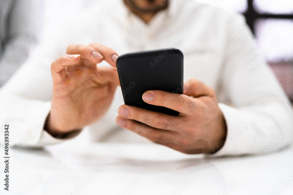 Man's Hand Holding Cell Phone Man's Hand Holding Cell Phone