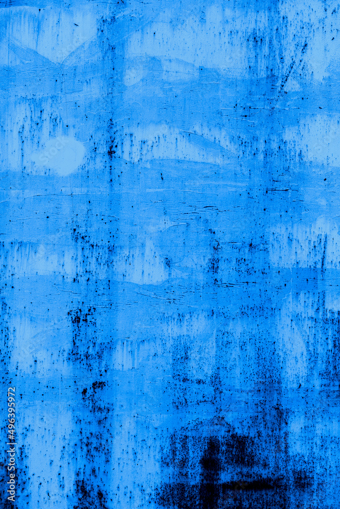 Rough metal texture with a blue-cyan tint. Concept of street photography. Graffiti element in design.