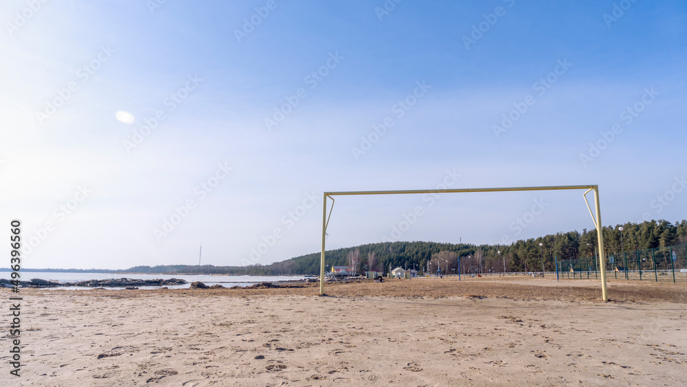 Soccer goal post on the beach with sand and blue sky. Football gate, beach soccer. Football gate at empty beach. Soccer goal post on the beach with sand and blue sky. Football gate, beach soccer. Football gate at empty beach.