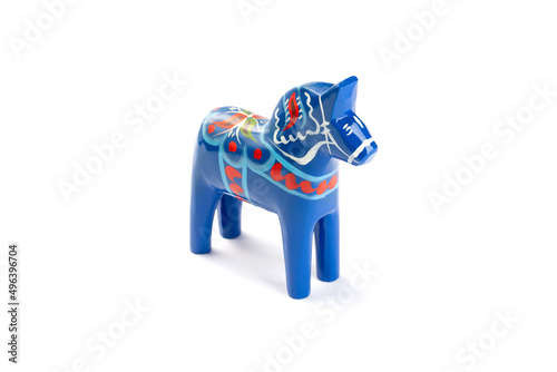 Swedish traditional souvenir wooden Dala or Dalecarlian horse, blue colored, isolated on white, side photo