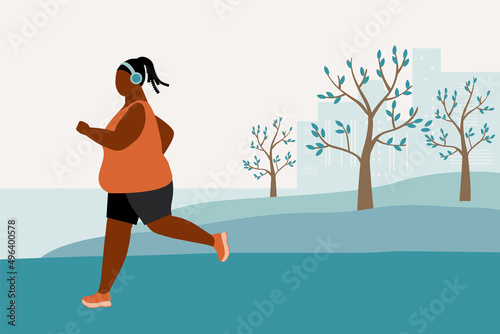 Young Overweight Black Woman Jogging Alone In The Park While Listening To Music.