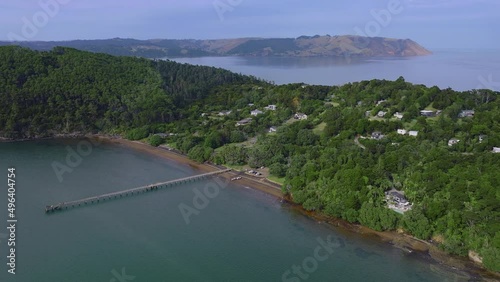 Aerial: A view of the manukau heads from Cornwallis, Auckland, New Zealand photo