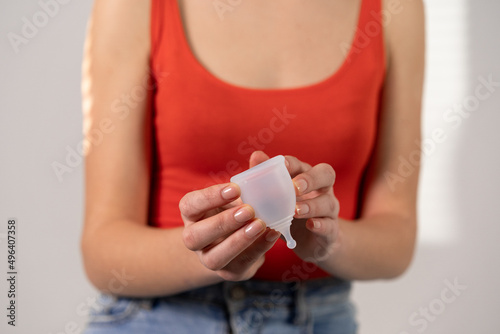 White menstrual cup for women's health. Horizontal photo.