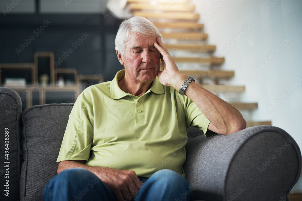 What could be causing these headaches. Shot of a senior man suffering from a headache at home. What could be causing these headaches. Shot of a senior man suffering from a headache at home.