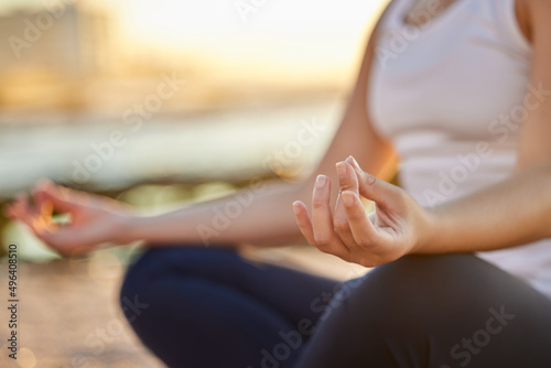 Time to meditate. Cropped shot of an unrecognizable young woman meditating on the beach. © Kirsten D/peopleimages.com