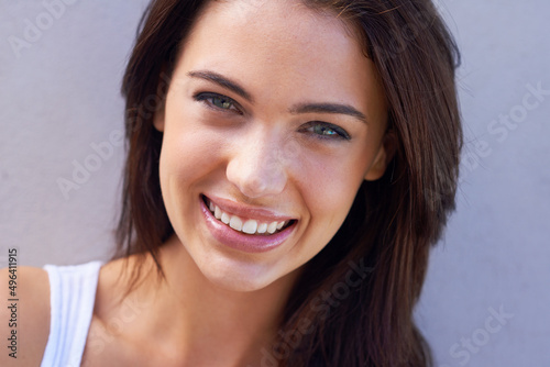 She could charm anyone. Studio portrait of a beautiful young brunette.