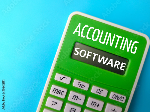 Top view calculator with text ACCOUNTING SOFTWARE on a blue background.
