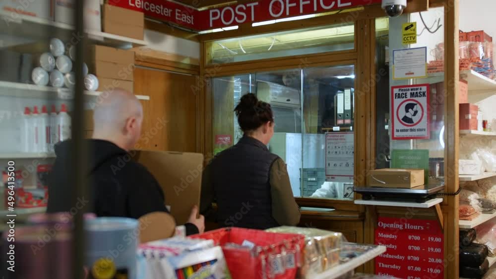 Line of people in a queue in a post office shop