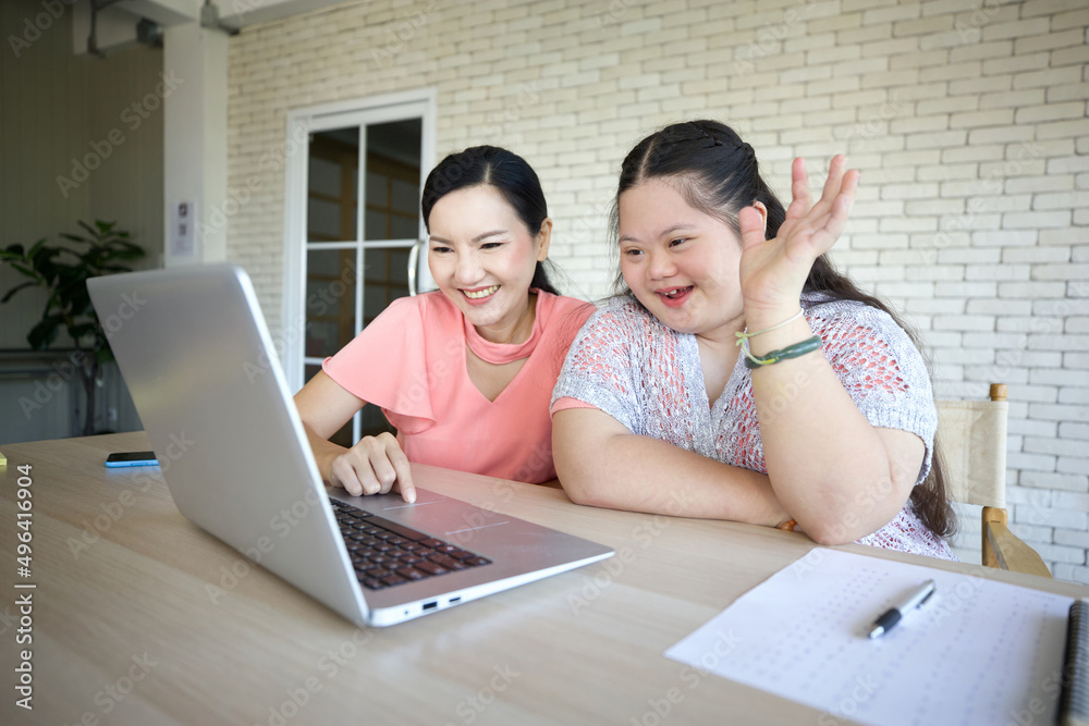 young teenage girl and her teacher studying how to use laptop computer and talking online to someone young teenage girl and her teacher studying how to use laptop computer and talking online to someone