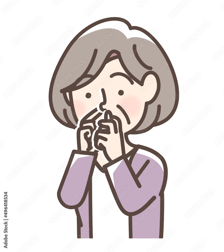 点鼻薬を使用している女性 点鼻薬を使用している女性