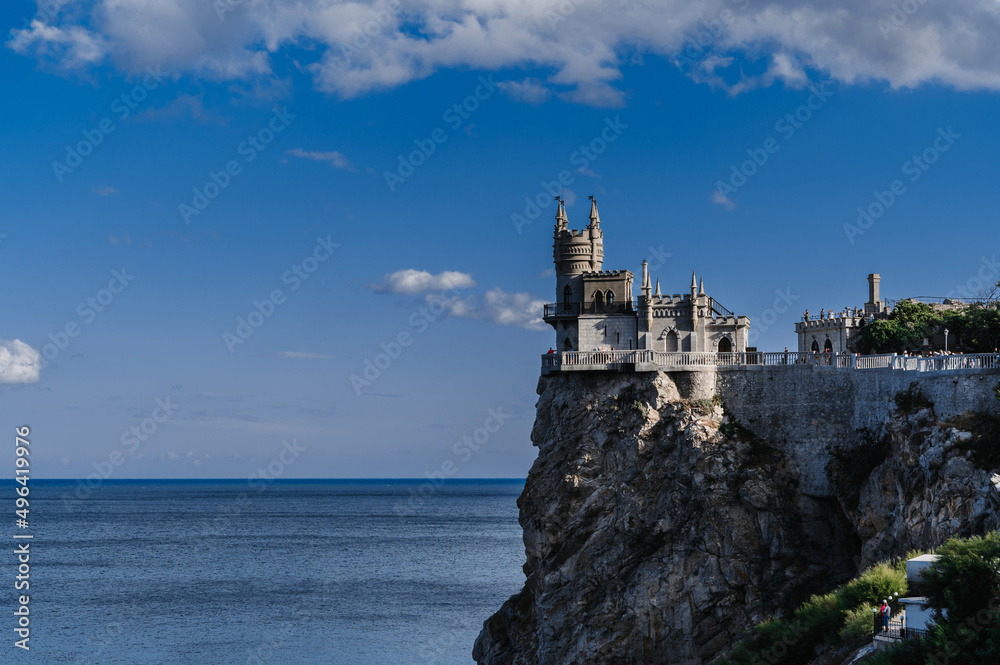 Swallow's Nest Castle in Crimea on a rock on a sunny summer day. Famous tourist landmark in Russia Swallow's Nest Castle in Crimea on a rock on a sunny summer day. Famous tourist landmark in Russia
