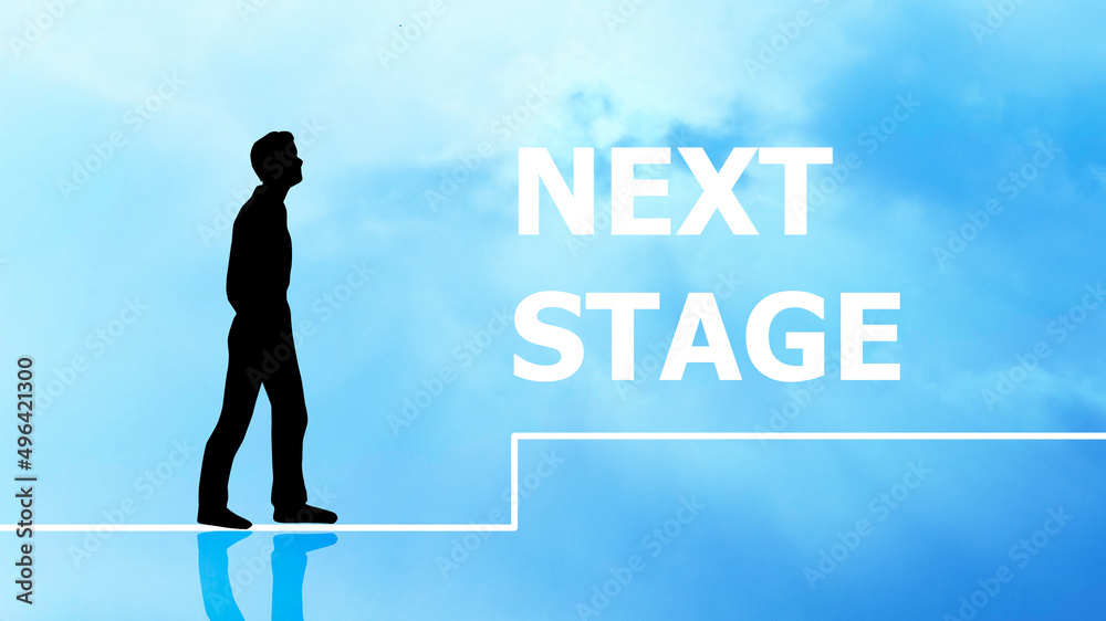 Obraz premium 歩く男性のシルエットとNEXT STAGEの文字_ワイド