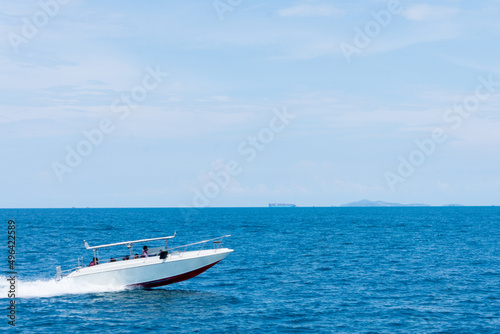 speedboat is moving in the blue sea.